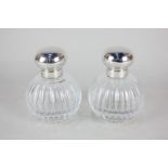 A pair of Elizabeth II silver mounted cut glass scent bottles, maker MMH, Birmingham 2000