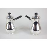 A pair of Victorian silver chocolate pots, baluster shape with side handles, engraved initials