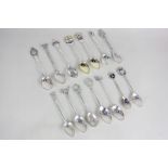 A collection of fourteen mixed silver commemorative teaspoons including Australian cities, some