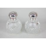 A pair of Elizabeth II silver mounted cut glass scent bottles, maker Carr's of Sheffield Ltd,