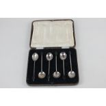 A cased set of six George V silver bean handled coffee spoons, maker Cooper Brothers & Sons,