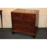 A George III mahogany chest, on two short over two drawers, with brass swan drop handles, on bracket