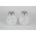 A pair of Elizabeth II silver mounted cut glass scent bottles, maker KH, Birmingham 1998