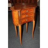 A French gilt metal mounted marquetry inlaid kidney shaped side table, with three drawers, on