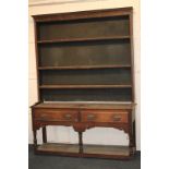 An oak dresser with three open shelves above base with two drawers, and pot shelf below, 148cm, (a/