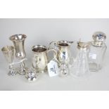 A George V silver cream jug with scroll handle, Birmingham 1926, a small mug, two small goblets with