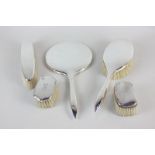 A modern silver dressing table set of two brushes and a hand mirror, maker W I Broadway and Co,
