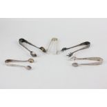 A collection of five Victorian and later silver sugar tongs, Levi & Salaman 1900; Robert Pringle &