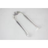 A pair of George III silver sugar tongs with spring action, engraved initials, 13cm