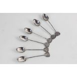 A set of six Chinese white metal coffee spoons marked 90, with flower finials