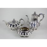 A George IV silver teapot, melon form with cast scroll handle, on pedestal foot, maker Richard