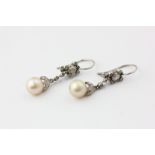 A pair of pearl and diamond drop earrings, the pearls on chains set with rose and old cuts, with