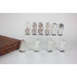 A cased set of ten Indonesian silver menu holders in the form of Wayang puppets