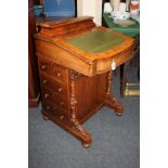 A Victorian walnut Davenport desk with stationery box, raised back, green tooled leather rising top,