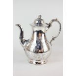 A Victorian silver coffee pot, baluster form with domed lid and bud finial, scroll handle and
