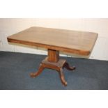 A Victorian tilt-top mahogany breakfast table with shaped rectangular top, on square banded stem and