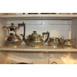 A silver plated four-piece tea set of half reeded design