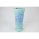 A Van Briggle American studio pottery vase in aqua matte glaze decorated with a columbine, the