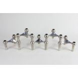 A set of five silver plated mid 20th century modular candle holders in the style of Caesar