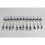 A matched set of twelve William IV and later silver fiddle pattern teaspoons, makers John Cook,