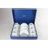 A boxed Royal Worcester porcelain set of six coffee cups and saucers, in the Woodland pattern