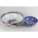 A large Japanese Imari bowl (a/f), 31cm diameter, together with a blue and white smaller bowl