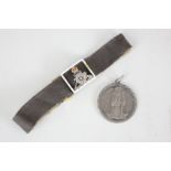 A Royal Artillery 'Sweetheart' bracelet, the black fabric strap strung with a gold, enamel and