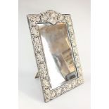 An Edward VII large silver mounted dressing table mirror, rectangular shape with pierced floral