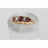 A ruby and diamond five stone ring