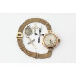 A 9ct gold wristwatch on gilt mesh bracelet, a 9ct gold and gem set cross, a silver cross and St