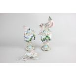 A pair of 19th century Continental porcelain jugs mounted with a figure of a bearded man and a