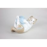 A Nao porcelain model of a kitten playing with a ball of wool, 10cm, sold to support the Cat and