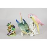 A Karl Ens porcelain figure group of two budgerigars on a branch, together with a porcelain model of
