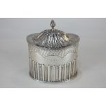 A Victorian silver tea caddy, maker Nathan & Hayes, Birmingham 1891, with half reeded and fluted