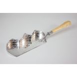 A Victorian silver plated crumb scoop with pierced raised back and engraved decoration, 34cm