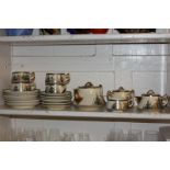 A Satsuma pottery tea set for six, including teapot, sugar bowl, milk jug and six teacups, saucers