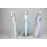 A Lladro figure of a lady wearing robed dress, 36cm, another in 1920's style dress, and a lady