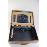 A gentleman's leather vanity case, with fitted interior containing brush, mirror, cologne bottles