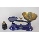 A set of Salter blue enamel kitchen scales with six weights