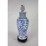 A Chinese blue and white porcelain baluster vase, now as a table lamp, on hardwood stand (a/f),