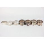 A set of four modern silver napkin rings of plain circular form, hallmarked London 1978, a pair of