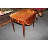 An Edwardian inlaid mahogany Pembroke table with oval banded top and single drawer, on square