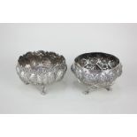 Two Indian white metal bowls, circular shape embossed with ten oval figures and scroll shaped
