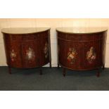 A pair of Edwardian rosewood floral painted demi-lune side cabinets, each with crossbanded top and