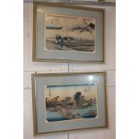 Three framed Japanese prints depicting figures in a mountain landscape, and boats beside a
