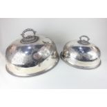 A silver plated domed dish cover with engraved decoration and central handle, 47cm, and another