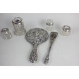 Four silver lidded cut glass dressing table jars, together with a silver backed hand mirror and a
