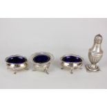 A pair of George V silver oval salts with blue glass liners, on paw feet, Birmingham 1919, (a/f),