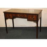 A George III style mahogany writing table with green leather inset rectangular top and three