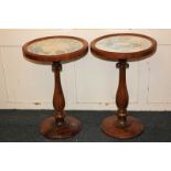 A pair of rosewood occasional tables, the glazed circular top inset with floral panels on lobed vase